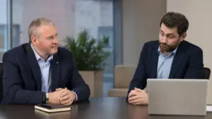 MSP salesperson in conversation with a prospect whose speech says 'yes' while their expression and body language show hesitation